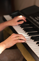 Fototapeta na wymiar hands on piano