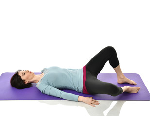 Mother woman exercising doing postnatal workout. Female fitness instructor stretching hands and...