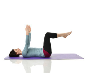 Mother woman exercising doing postnatal workout. Female fitness instructor stretching hands and legs in gym and work out exercises