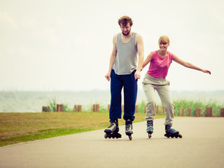roller skater couple skating outdoor