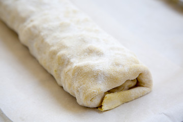 Raw apple pie or strudel, closeup.
