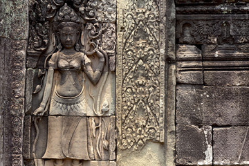 Carved stone bas-relief of Angkor Wat complex temple, Siem Reap, Cambodia. Historical site of khmer architecture.