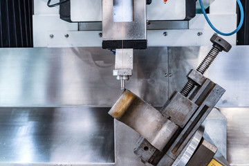 The metal part is installed in an electroerosive drilling machine.