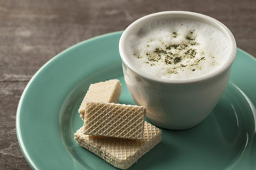 Cup of coffee with matcha tea