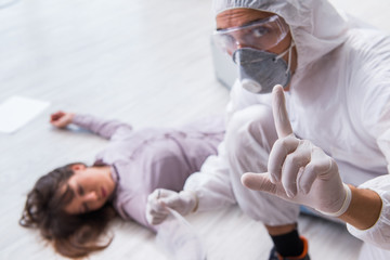 Forensic investigator at the crime scene investigating woman mur