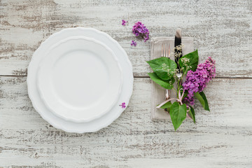 Fototapeta na wymiar Rustic table setting with lilac flowers