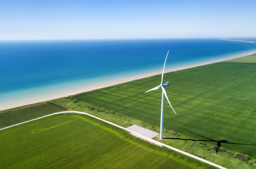 Wind power station on the field. Concept and idea of alternative energy development