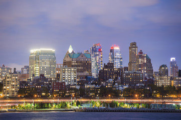 View of Manhattan skyline illuminated at dusk. New York City, USA.