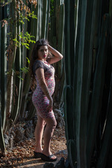 Young latina student posing in a cactus botanical garden