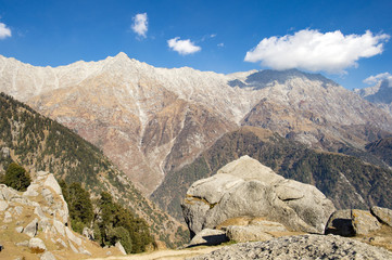 'Selective focus' A beautiful view of Dhauladhar Mountain ranges during a sunny day and some clouds. Triund, Himachal Pradesh. India