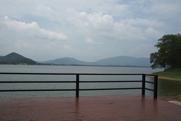 Fototapeta na wymiar Terrace, water and mountain/Water and mountain view from the balcony. Bang Phra Reservoir, Chonburi Province, Thailand