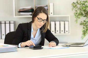 Bookkeeper doing accounting at office
