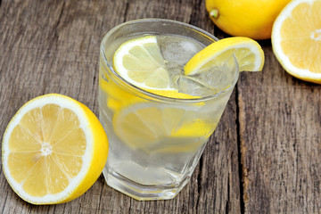 Detox water with fresh lemon and ice cubes in a glass