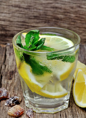 Water with fresh lemon and mint in a glass