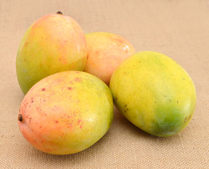 mangos on burlap background