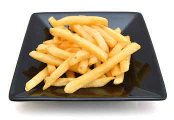 a pile of french fries isolated in black plate on white
