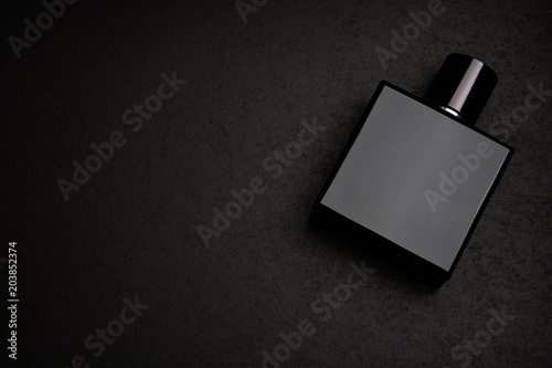 Download "Mockup of black fragrance perfume bottle mockup on dark ...
