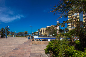 Promenade. A sunny day in the street of Marbella. Malaga province, Andalusia, Spain. Picture taken &ndash; 3 may 2018.