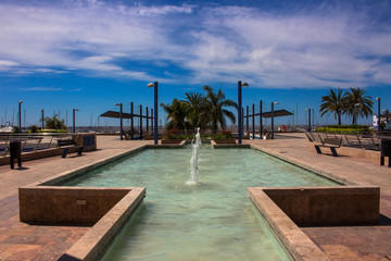 Promenade. A sunny day in the street of Marbella. Malaga province, Andalusia, Spain. Picture taken – 3 may 2018.