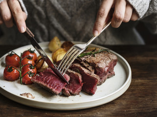 Close up of a cutting a fillet steak food photography recipe idea