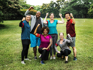 Group of cheerful diverse friends in the park - obrazy, fototapety, plakaty