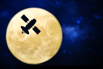 Satellite silhouette over a full moon - obrazy, fototapety, plakaty
