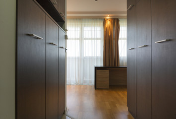 Corridor with closet in hotel room