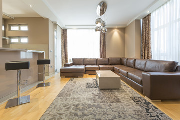 Interior of a modern open plan hotel apartment, living room