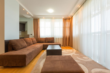 Interior of a modern open plan hotel apartment, living room