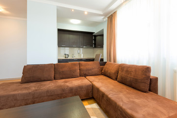 Interior of a modern open plan hotel apartment, living room