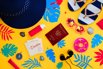 Header with traveling essentials pattern on a vibrant yellow background. Summer vacation accessories, sunglasses, flip-flops, sunscreen, tiny swim ring, shells, Modern colorful palette.