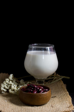 soybean milk and redbean seed isolate on black background
