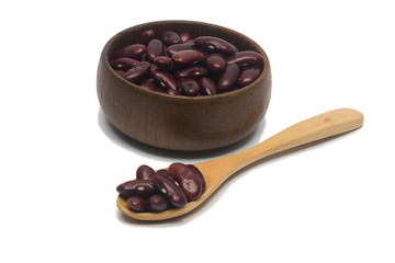 Red Peanut on Cup made of wood and spoon on white background
