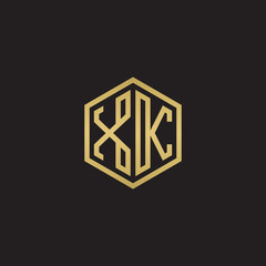 Initial letter XK, minimalist line art hexagon shape logo, gold color on black background