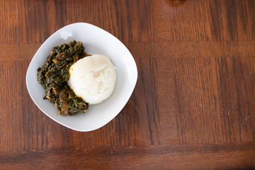 Nigerian Pounded Yam Served with Vegetable Soup