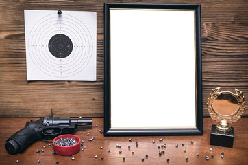 Best shooter diploma. First place winner in shooting. Professional shooter certificate mock up. Gun, gold medal and blank photo frame.