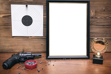 Best shooter diploma. First place winner in shooting. Professional shooter certificate mock up. Gun, gold medal and blank photo frame.