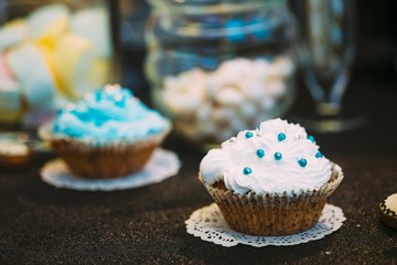 Dessert Sweet Tasty cupcake in Candy Bar On Table
