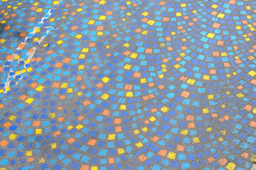 Painted mosaic pattern on a sidewalk