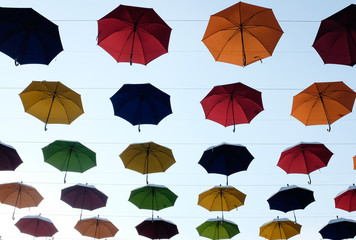 Fototapeta na wymiar colorful umbrella with bring blue skies 