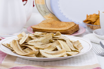 Banana Chips Popular Deep Fried Tea Time Snack Also Know As Most Famous South Indian Snack And Banana chips are commonly found in India and Indonesia.