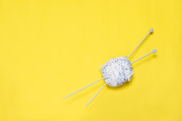 Top view of yarn on yellow background