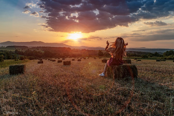 Fototapeta premium Countryside sunset with girl