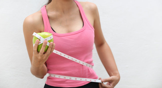 Young woman with apple on hand ,diet concept.