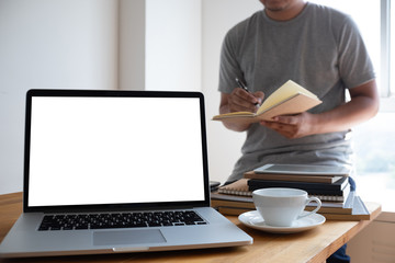 Laptop with blank screen on table. Workspace background new project on laptop computer with blank copy space screen for your advertising text message