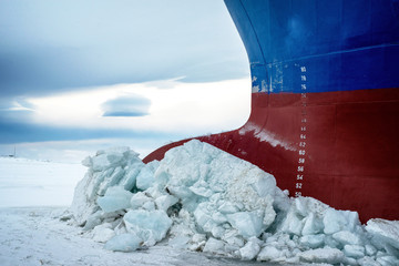 Nose icebreaker stuck in the ice of the Arctic landscape. Begins a snow Blizzard. - obrazy, fototapety, plakaty