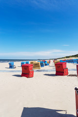 Red beach chairs on a sunny day at the Baltic Sea