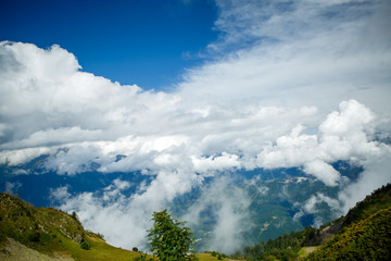 Naklejka premium Image of mountain slopes with vegetation, cloudy sky