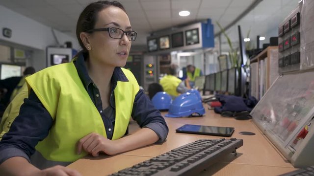 Industrial technician working in monitoring control room