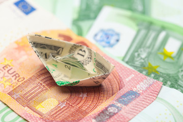 Money banknotes and paper boats. Business concept